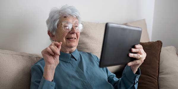 Independent Old Woman with Tablet